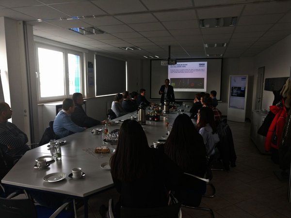 IEW participants listen to lecture 