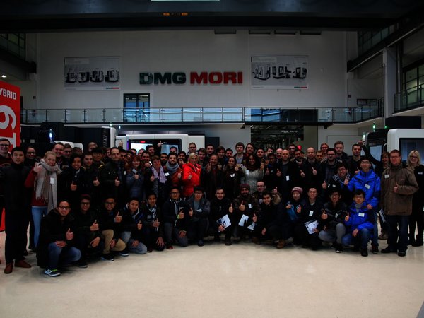 Group photo in front of DMG MORI