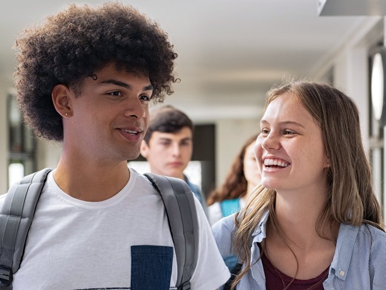 Two students laughing