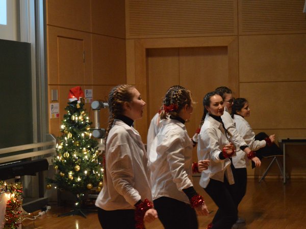 Dance group dance in auditorium