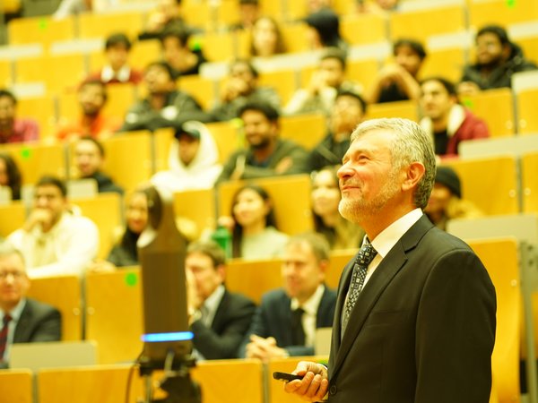 Prof Kolev shows something on the white board