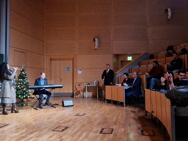 Giuliana and professor Hettler singing and playing piano