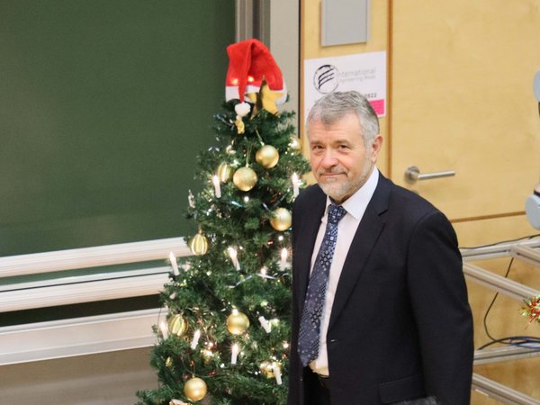 Professor Kolev next to the Christmas tree 