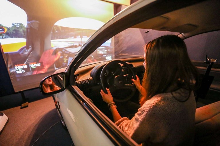 woman in a car drive simulator