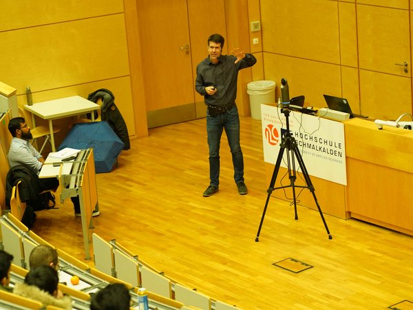 Lecture hall listens to presentation 