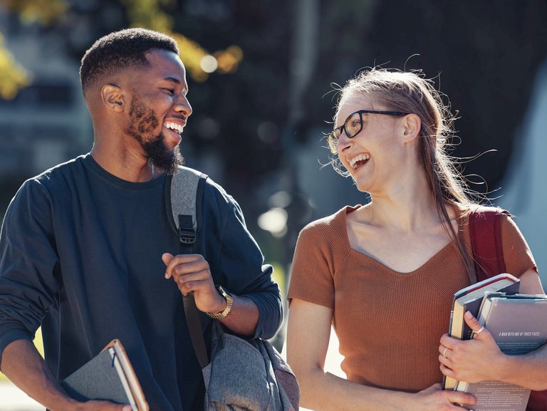 Two students laughing